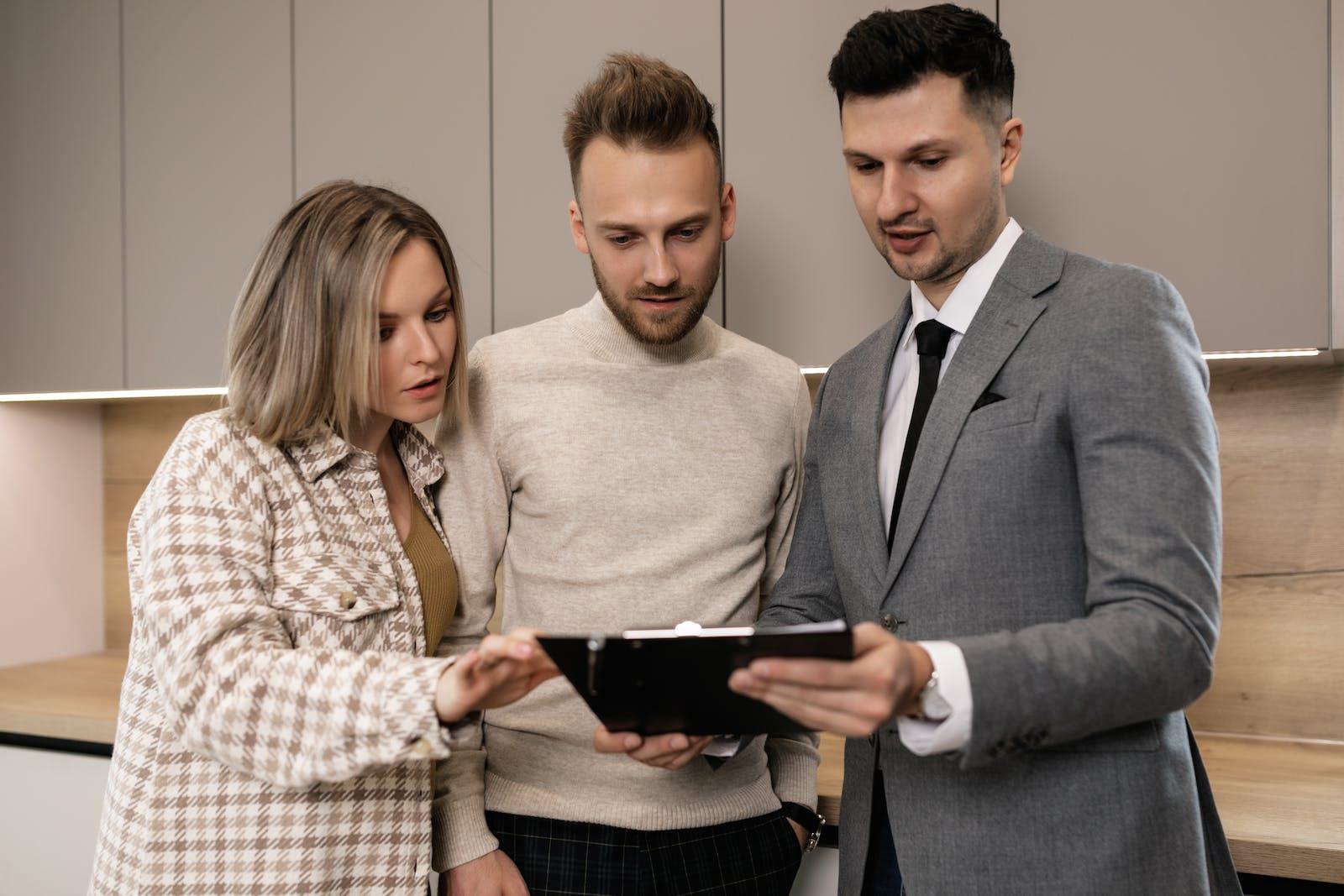 Letting agent Explaining guaranteed rent scheme
